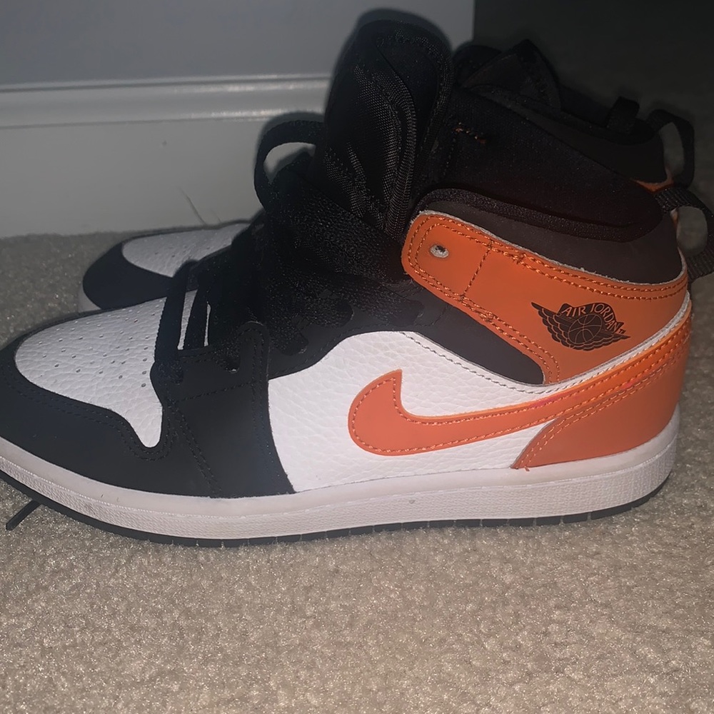 Orange, black & White Air Jordan’s